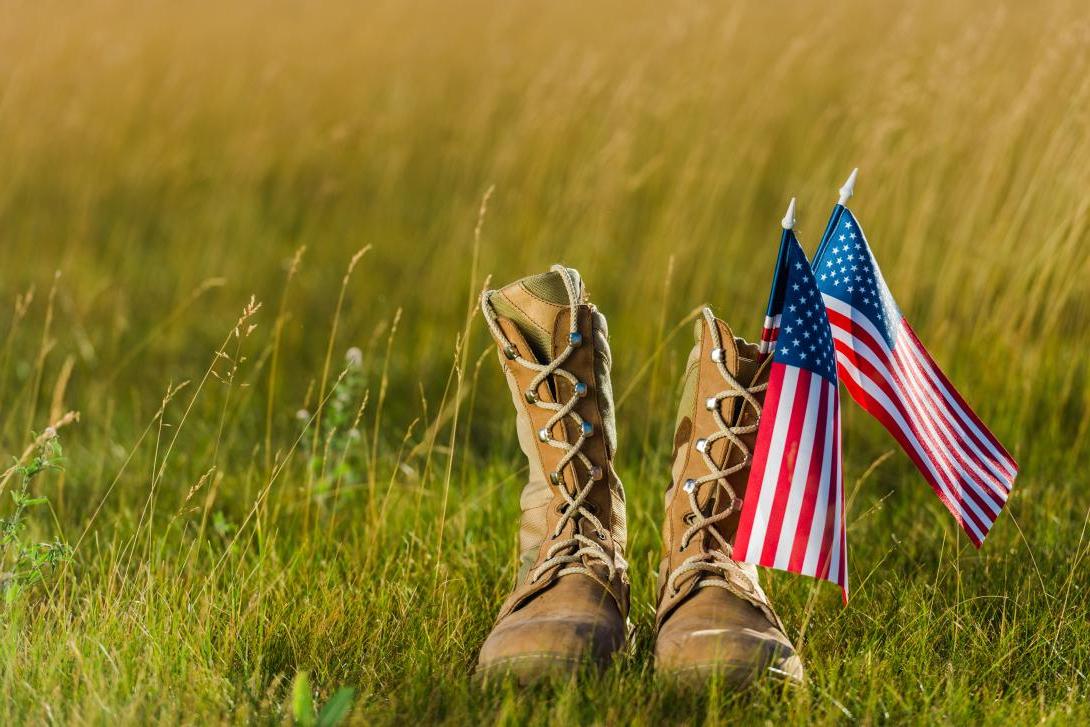 military boots near american flad